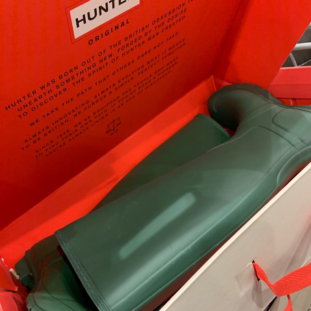 Tall Hunter green boots.